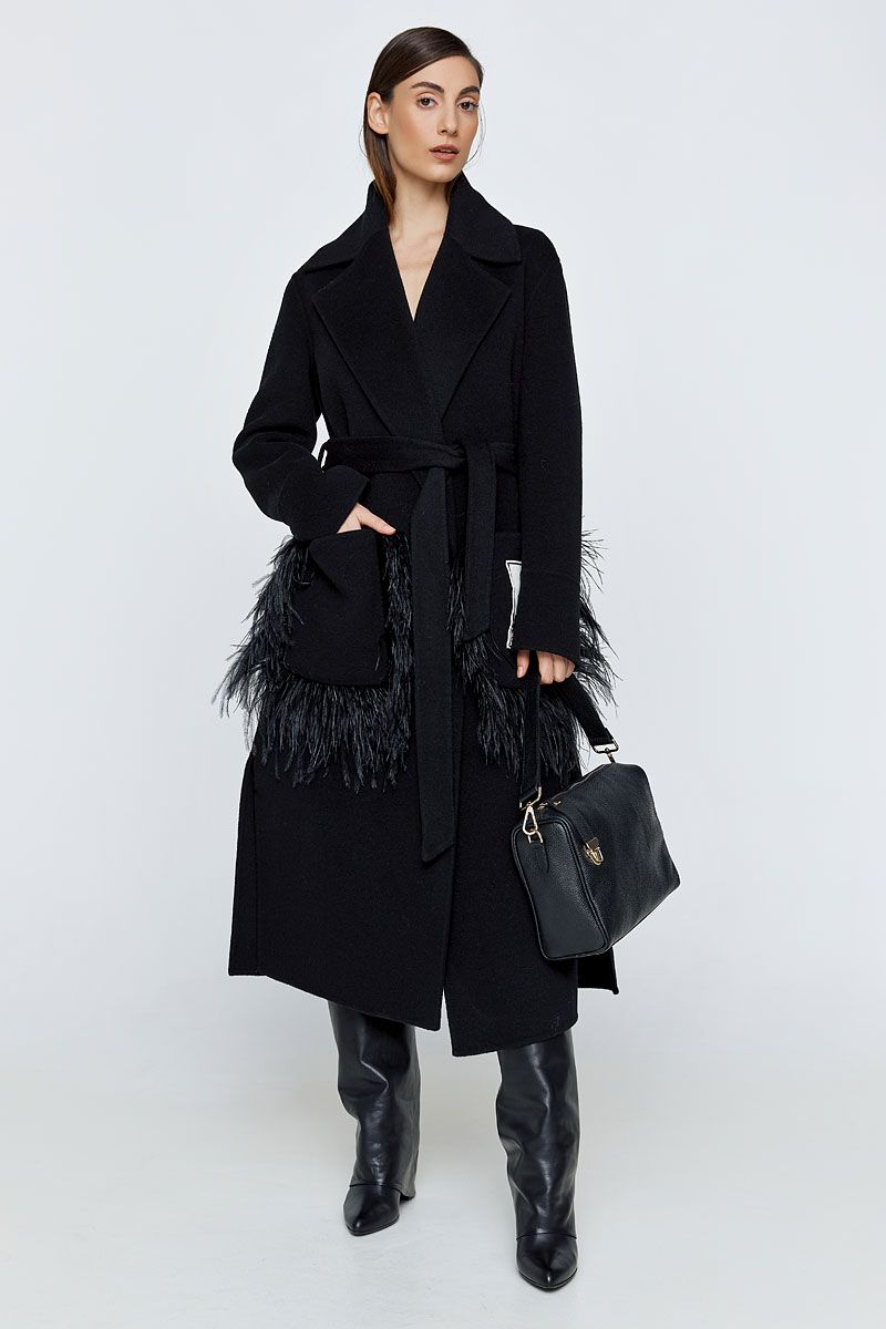Coat in black embellished with feathers