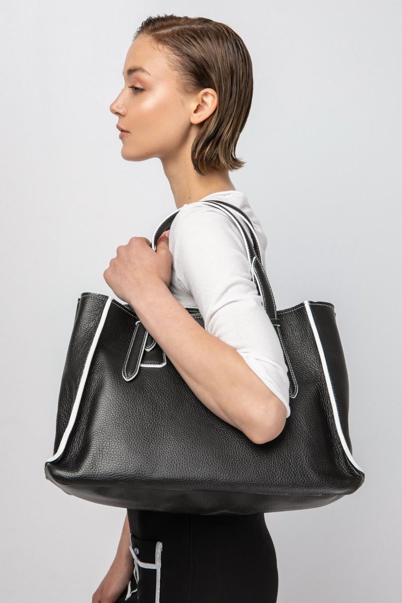 Black leather tote bag with white details