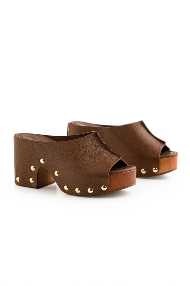 Studded leather clogs in brown 
