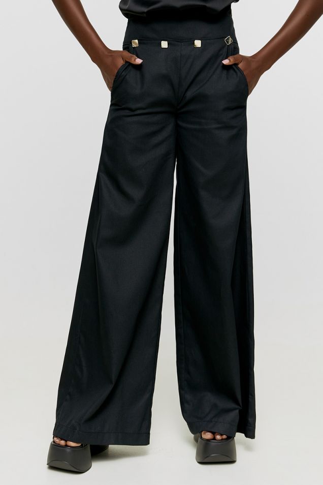 Loose pants in cotton gaberdine with gold buttons on the front