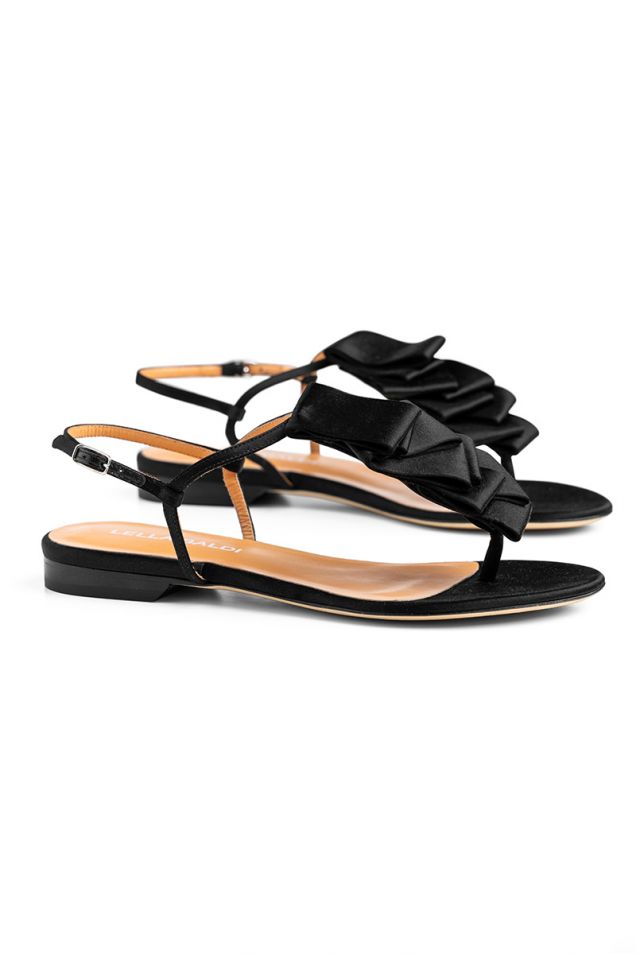 Flat sandals in black satin