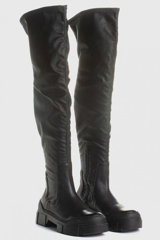 Black thigh-high boots in black leather/faux leather with lugged sole