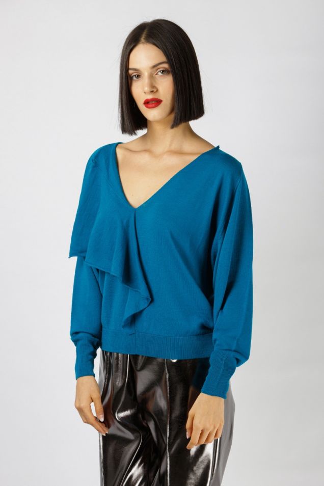 Knitted blouse in vibrant turquoise color